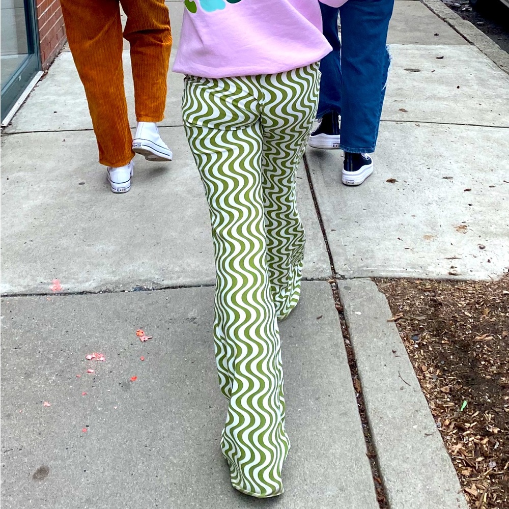Green and white wavy striped pants. No pockets, pull on, elastic waist band.